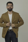 A male model wearing a Brown linen blazer with a notch lapel, two-button opening, and functional sleeves.