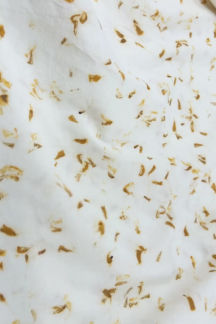 Hemp-cotton fabric hand eco-printed with marigold petals, full flat view